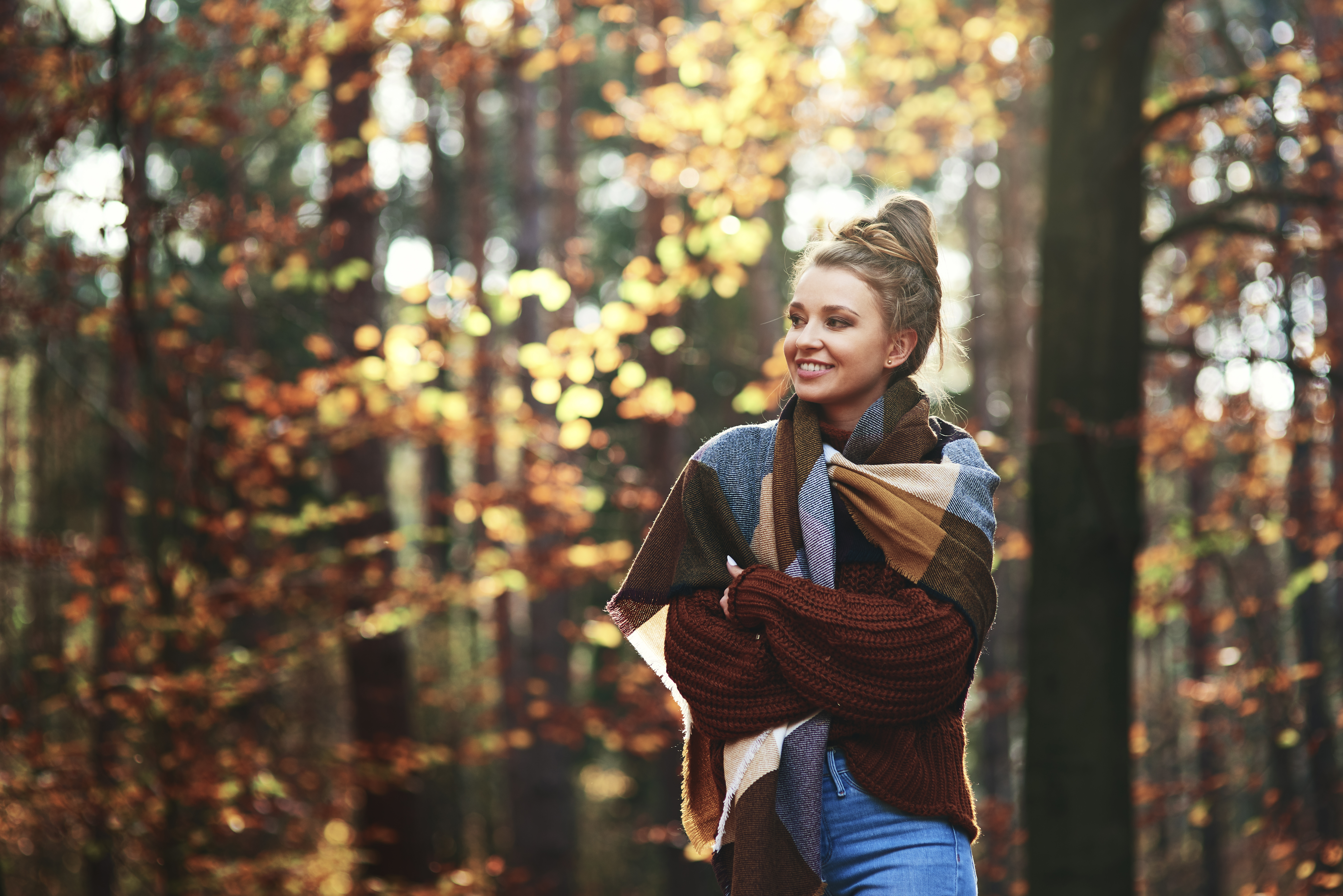 beautiful-young-woman-walking-autumn-forest.jpg